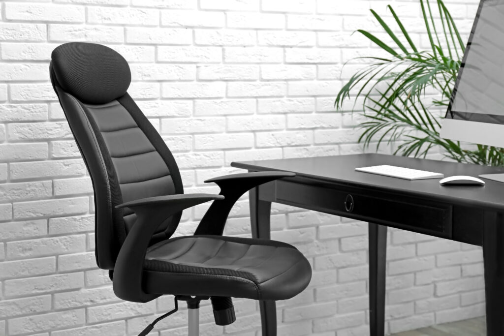 Stylish workplace interior with modern ergonomic office chair